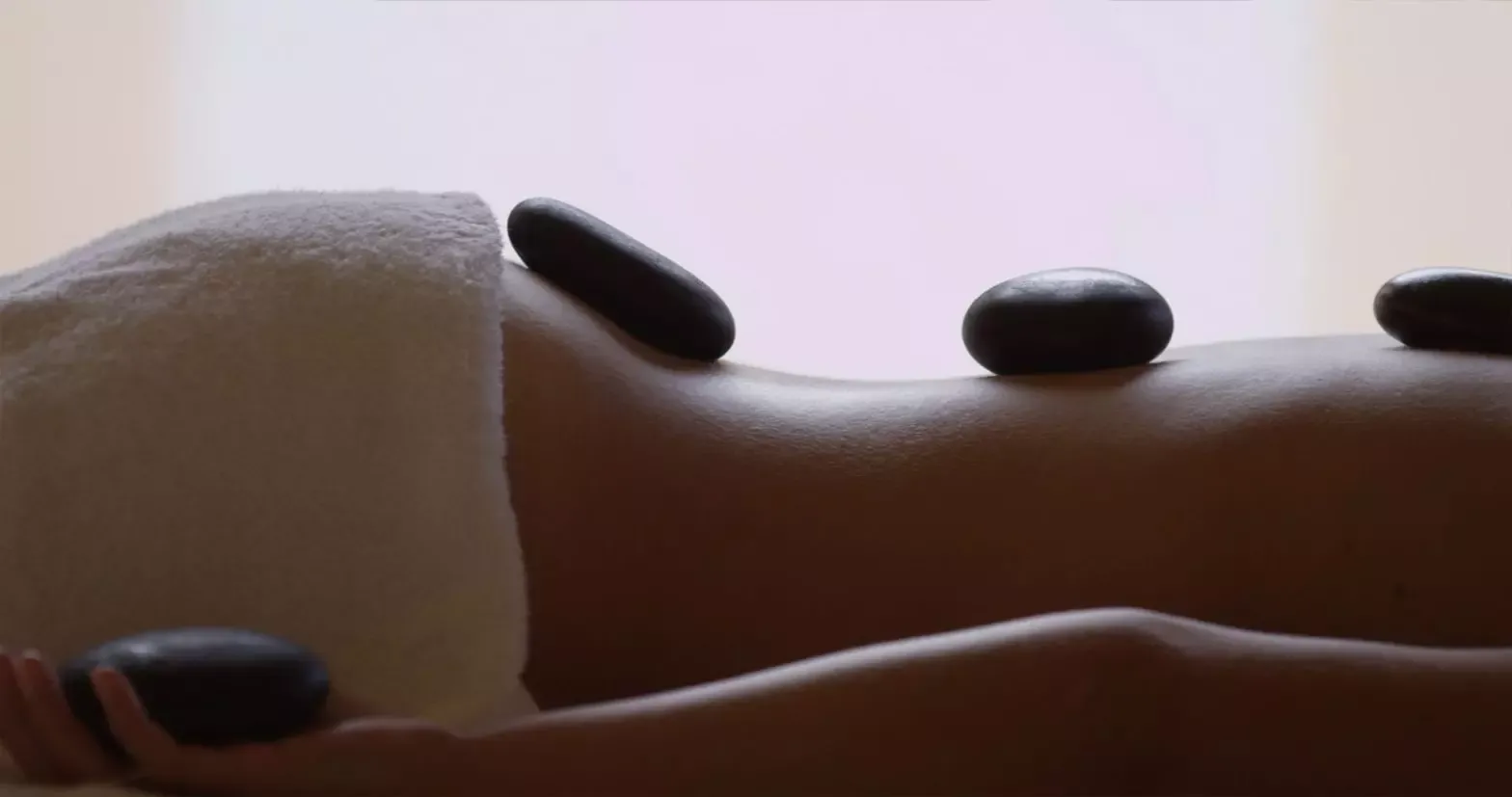 Warm basalt stones used during a hot stone back massage